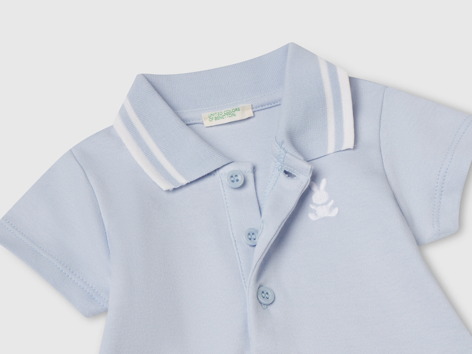 Body a polo in cotone da neonato celeste 3 | Benetton Outlet