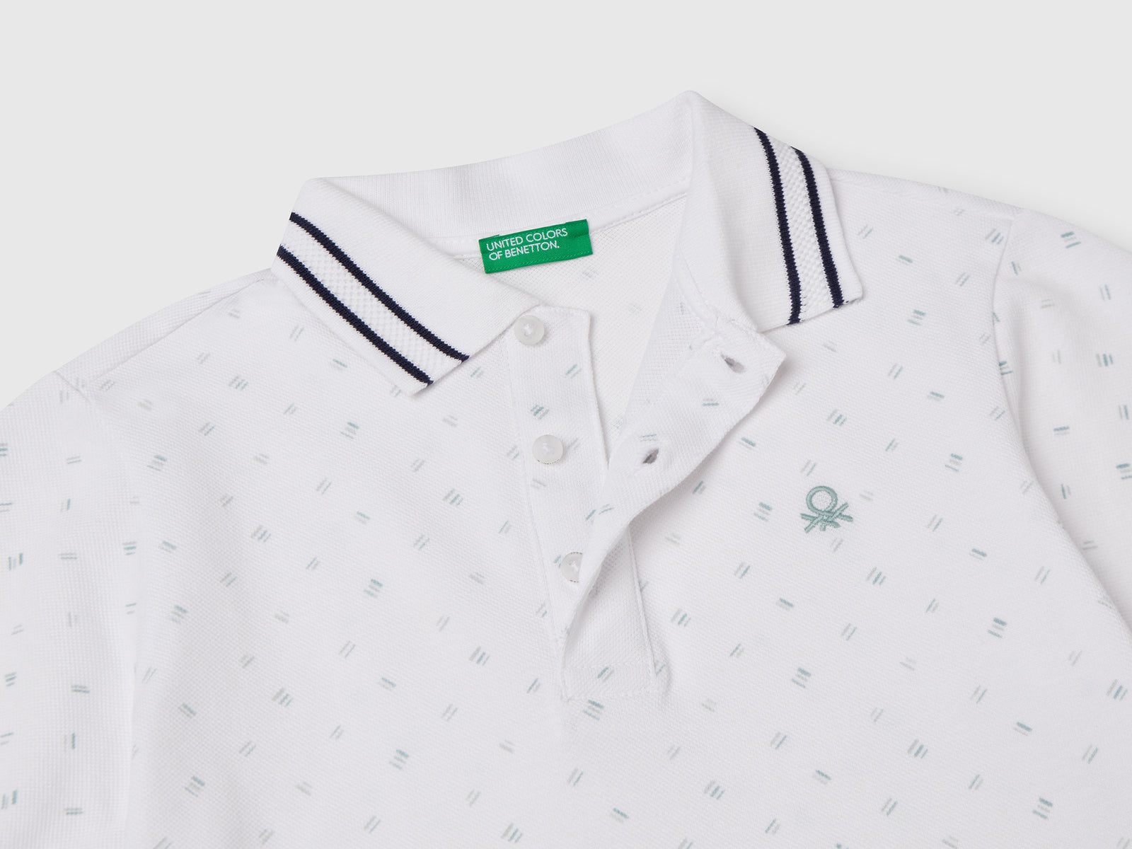 Polo micro fantasia in puro cotone da bambino bianco 3 | Benetton Outlet
