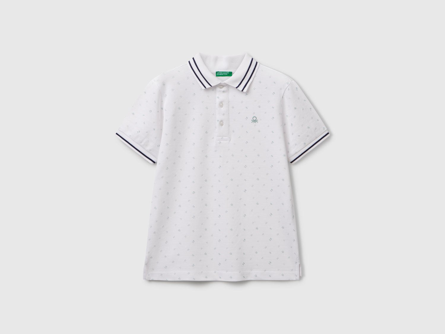 Polo micro fantasia in puro cotone da bambino bianco | Benetton Outlet