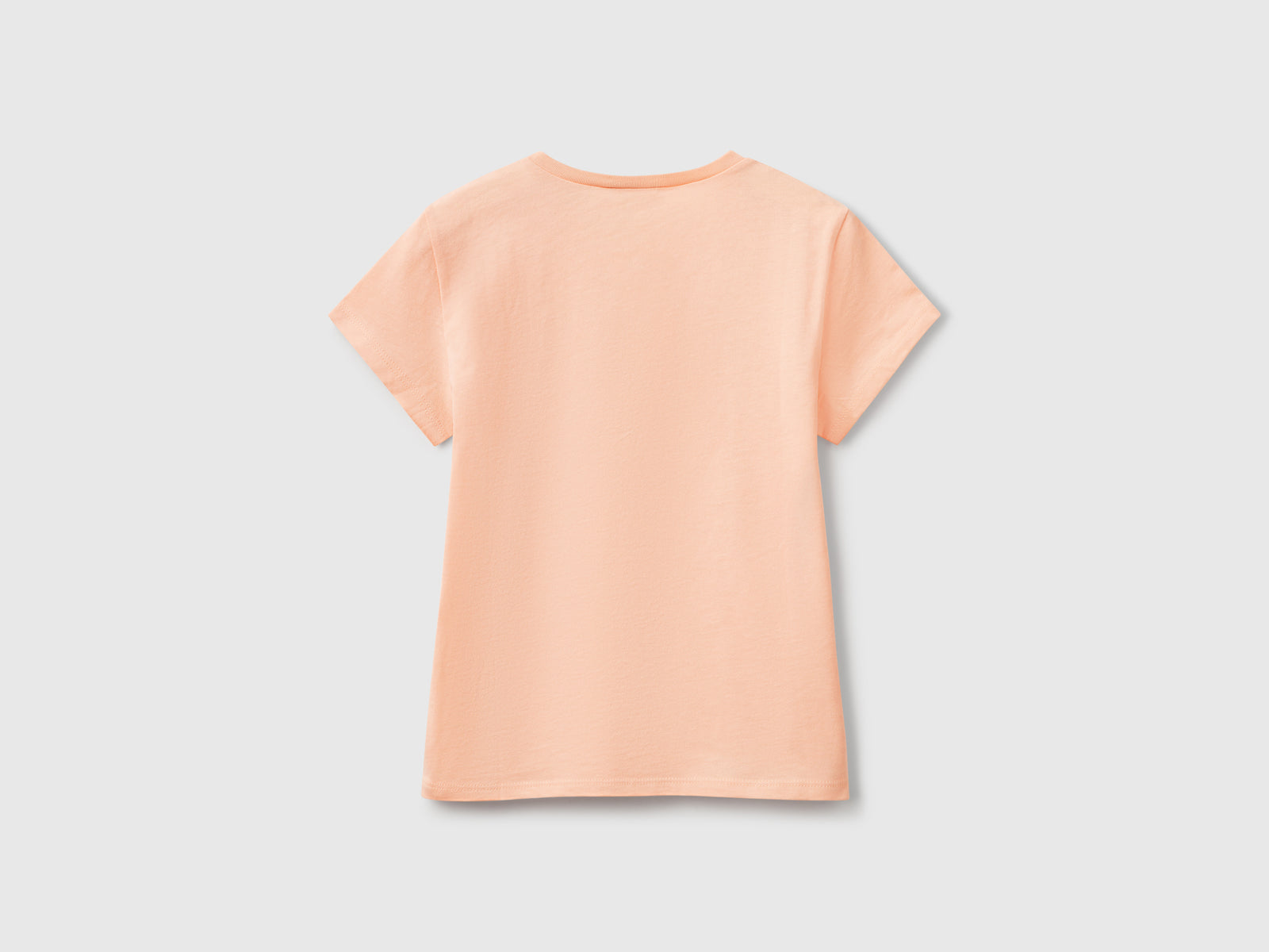 T-shirt con logo glitter in cotone da bambina pesca 2 | Benetton Outlet