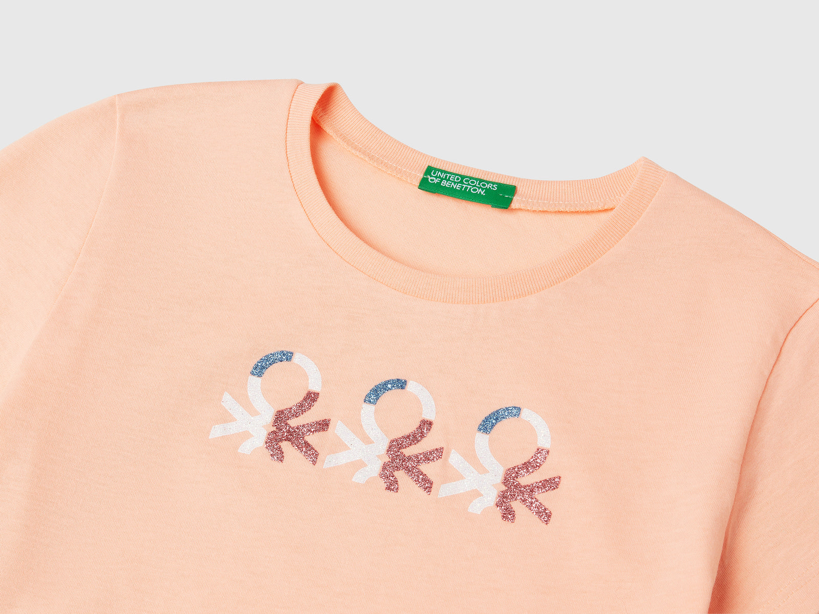 T-shirt con logo glitter in cotone da bambina pesca 3 | Benetton Outlet