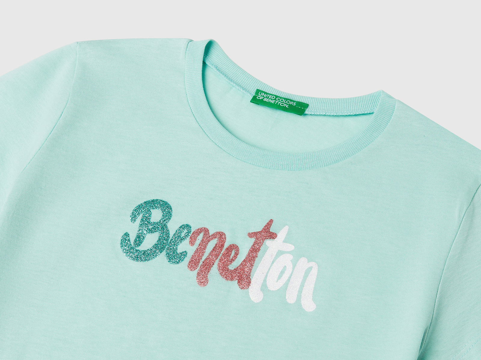 T-shirt con logo glitter in cotone da bambina verde acqua 3 | Benetton Outlet
