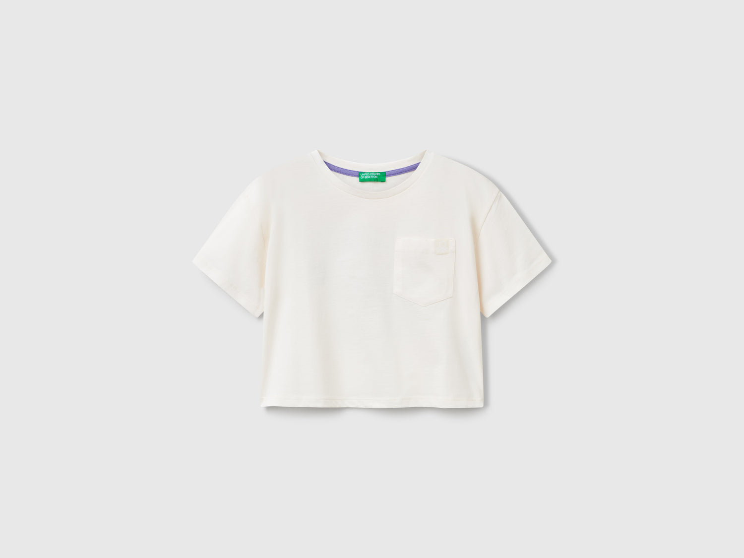 T-shirt boxy fit con stampa sul retro da bambina bianco panna | Benetton Outlet