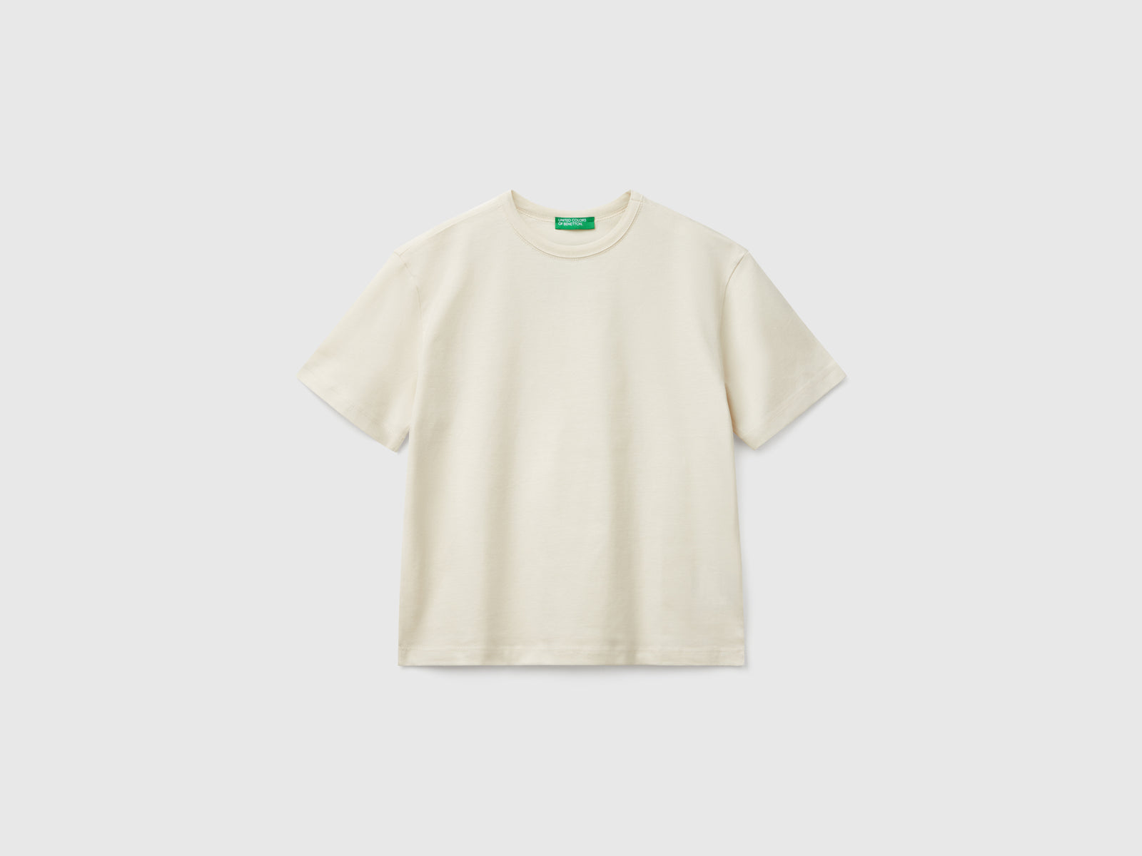 T-shirt con logo over fit da bambino beige | Benetton Outlet