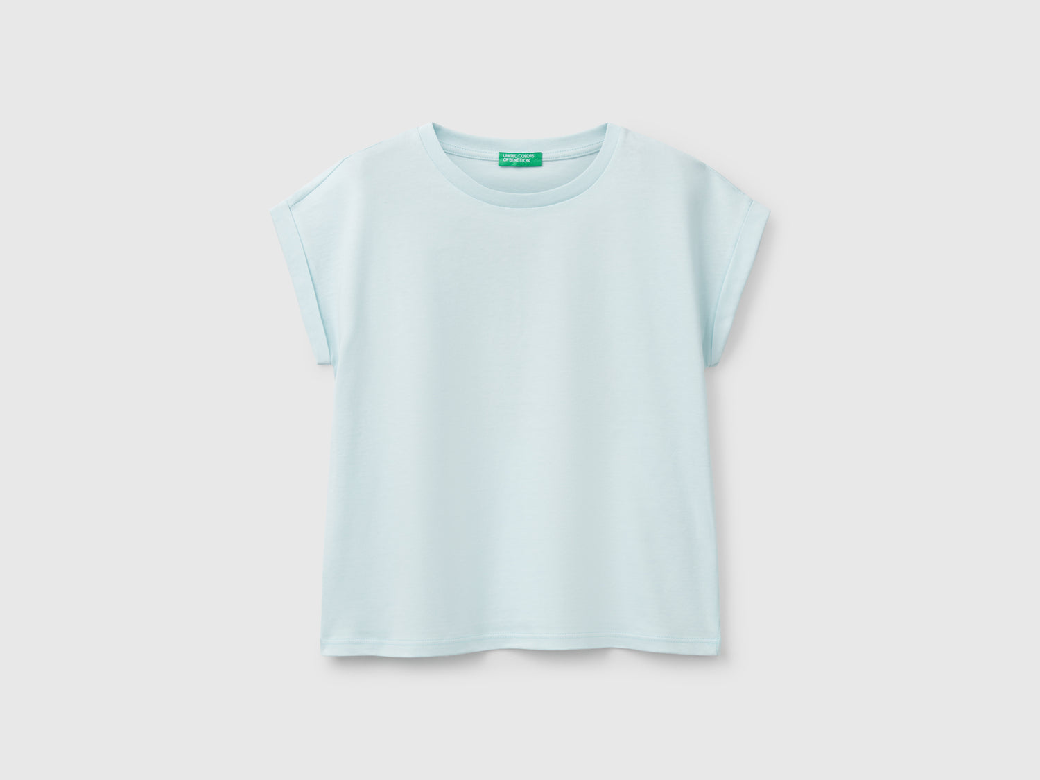 Maglietta boxy fit con stampa e glitter da bambina verde acqua | Benetton Outlet