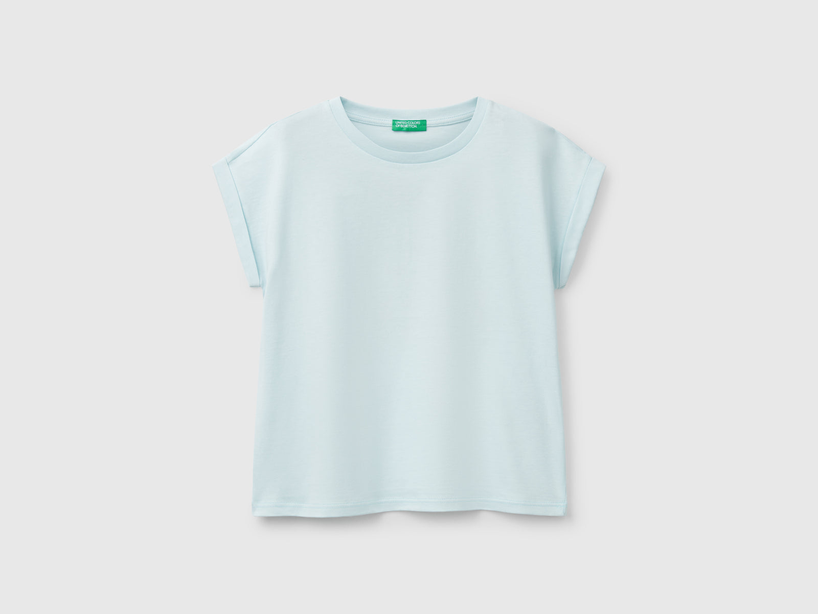 Maglietta boxy fit con stampa e glitter da bambina verde acqua | Benetton Outlet