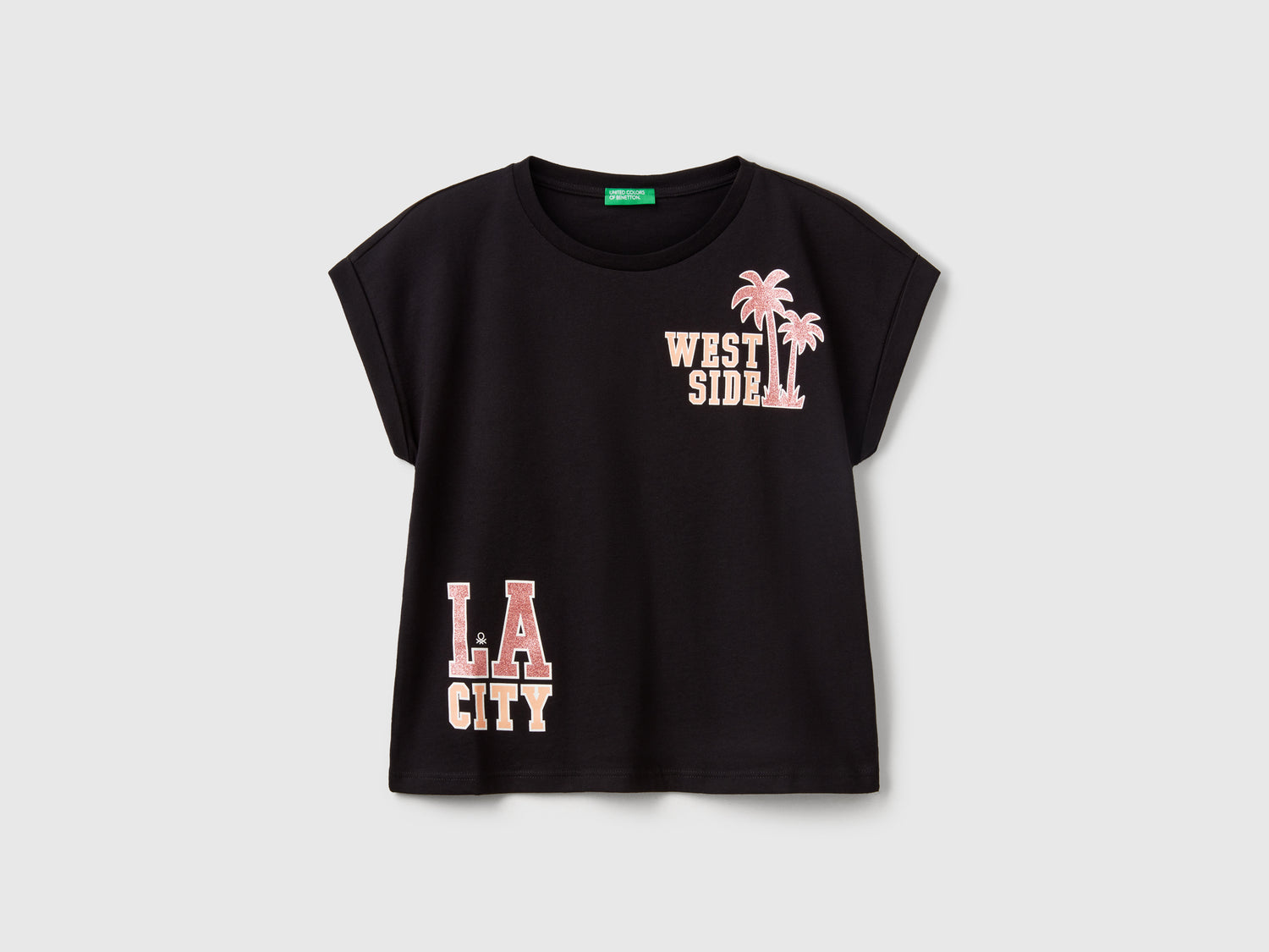 Maglietta boxy fit con stampa e glitter da bambina nero | Benetton Outlet