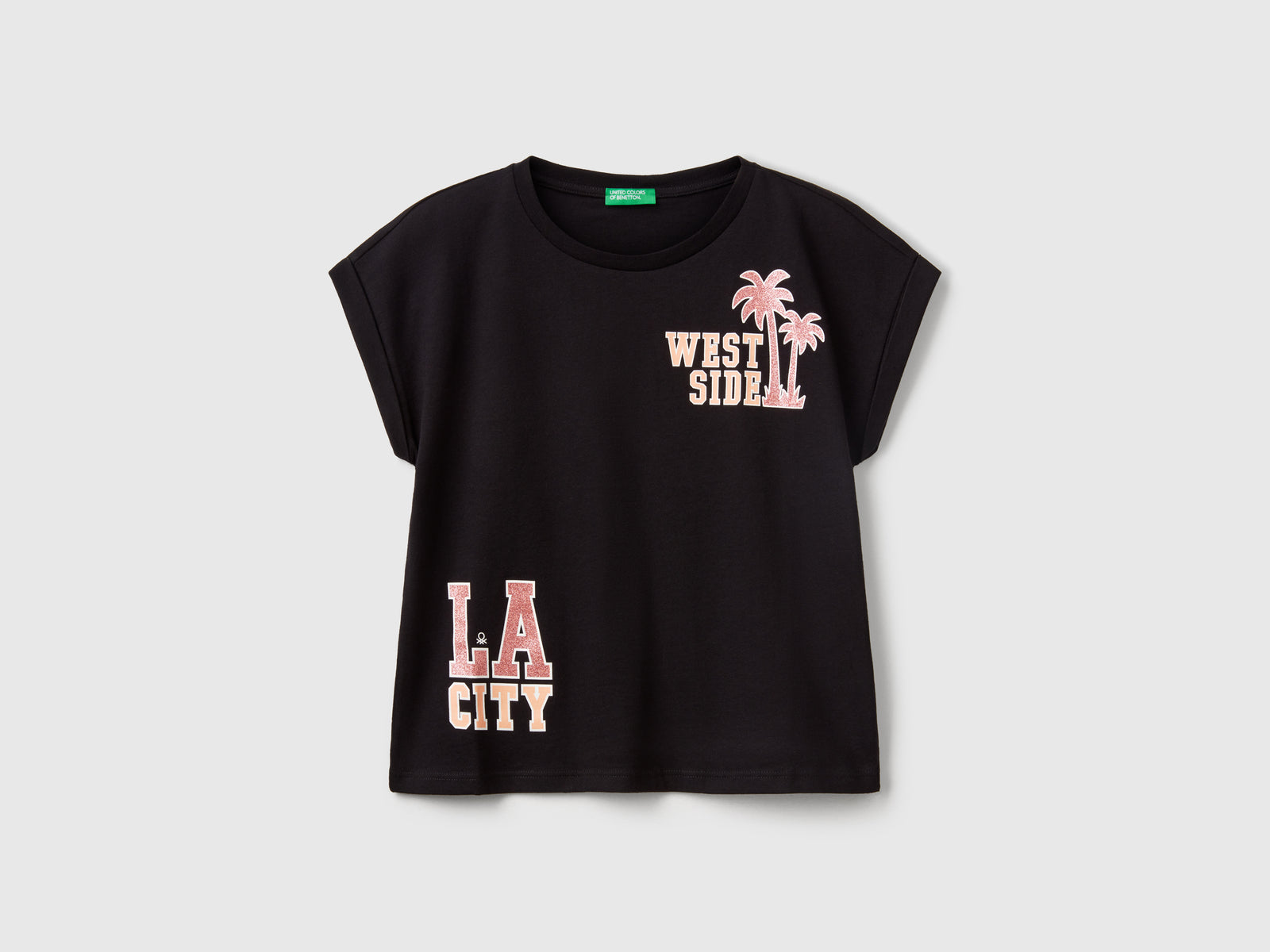 Maglietta boxy fit con stampa e glitter da bambina nero | Benetton Outlet