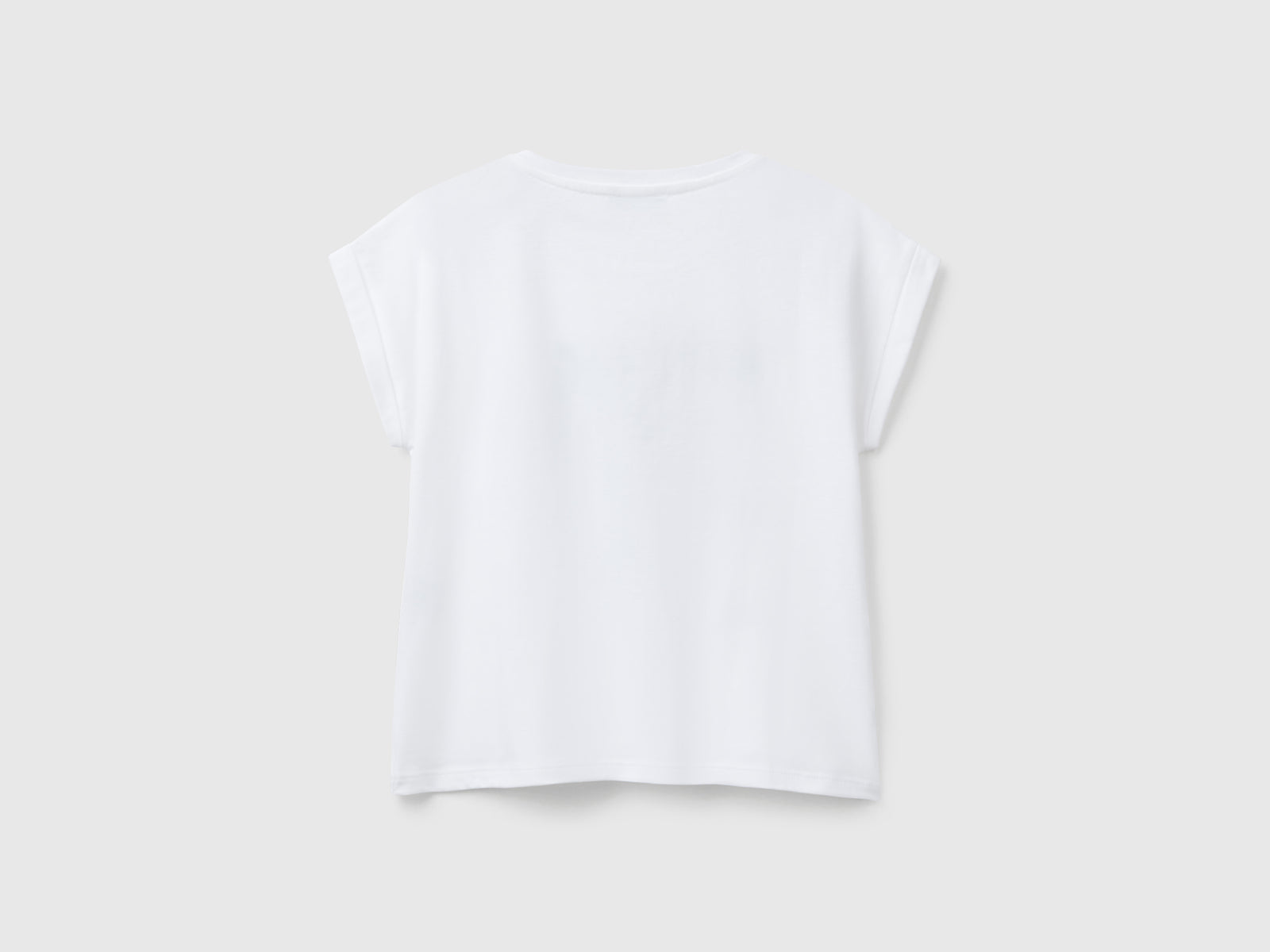 Maglietta boxy fit con stampa e glitter da bambina bianco 2 | Benetton Outlet