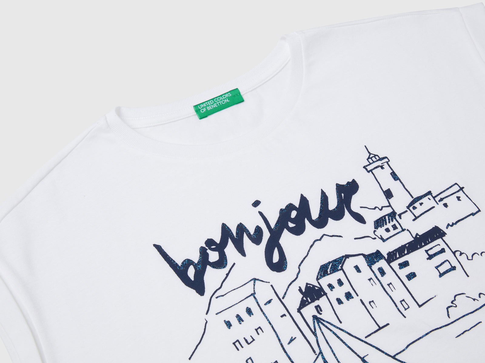 Maglietta boxy fit con stampa e glitter da bambina bianco 3 | Benetton Outlet