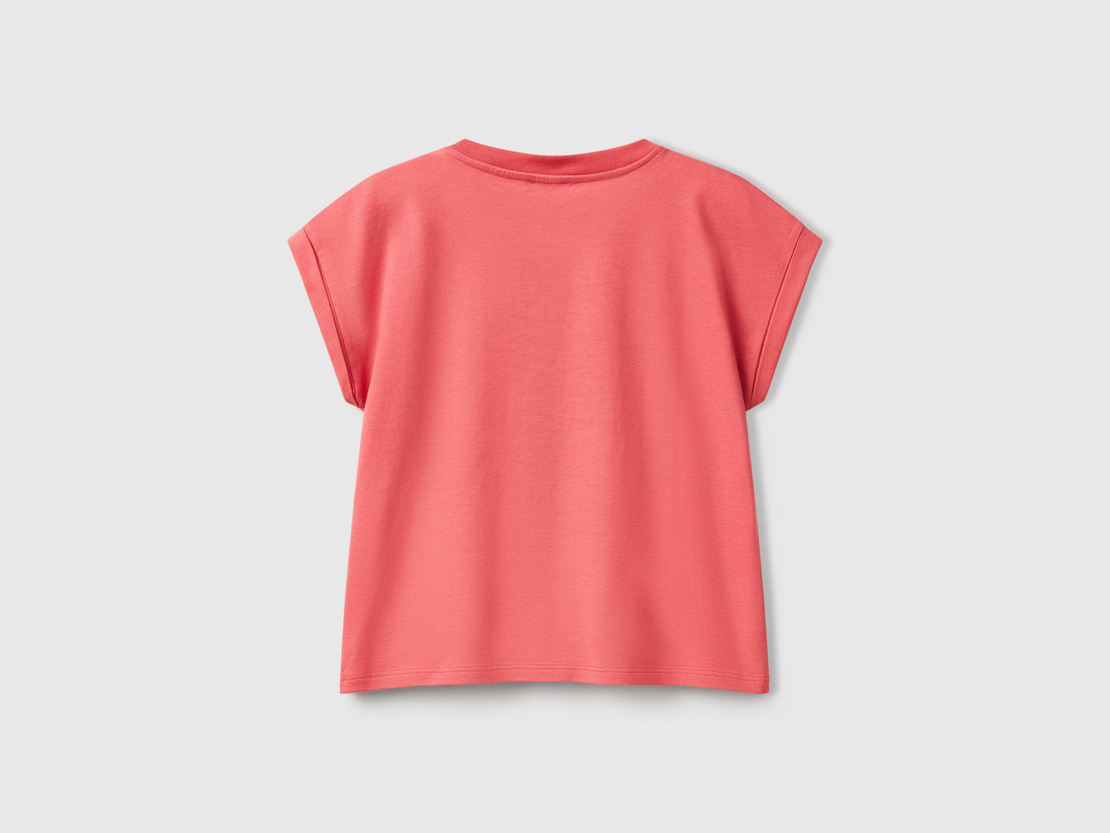 Maglietta boxy fit con stampa e glitter da bambina salmone 2 | Benetton Outlet