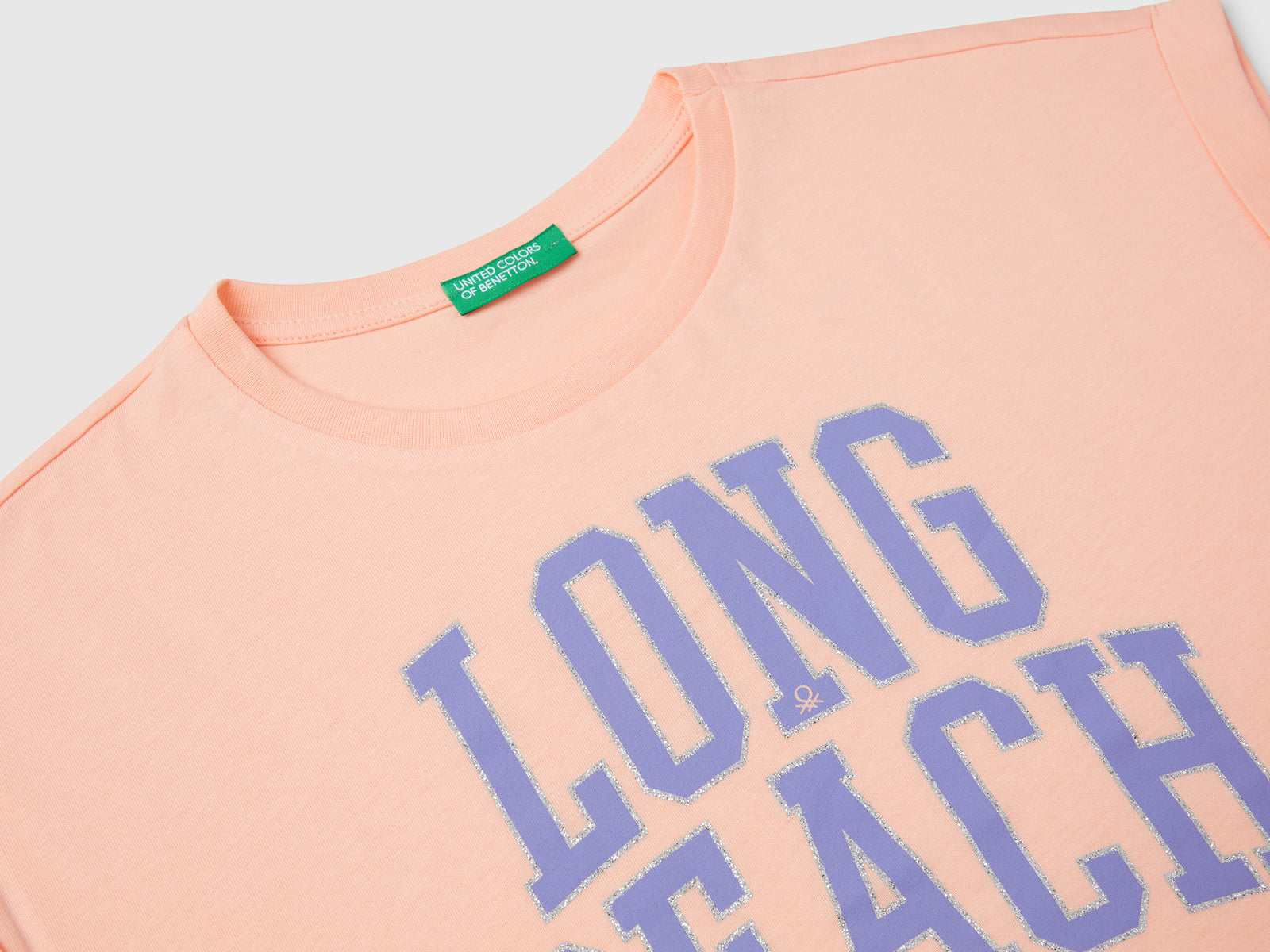 Maglietta boxy fit con stampa e glitter da bambina pesca 3 | Benetton Outlet