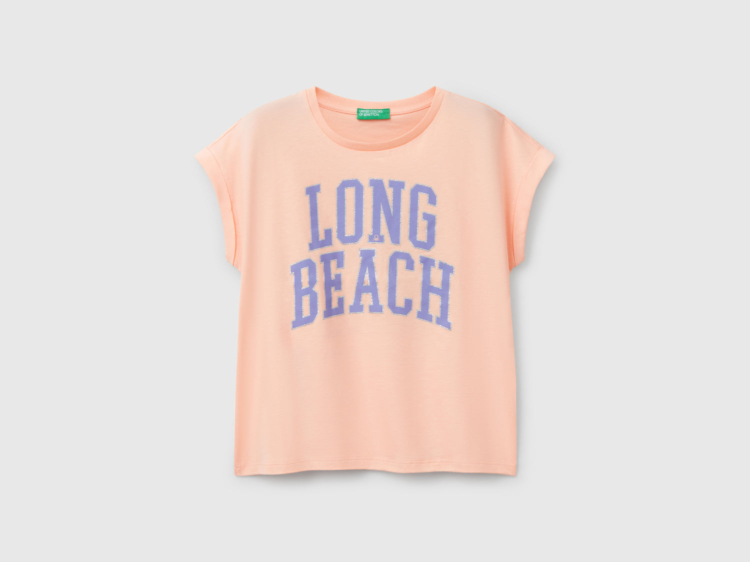 Maglietta boxy fit con stampa e glitter da bambina pesca | Benetton Outlet