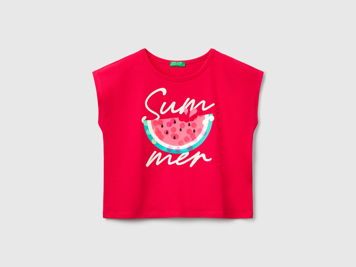 T-shirt con stampa e paillettes