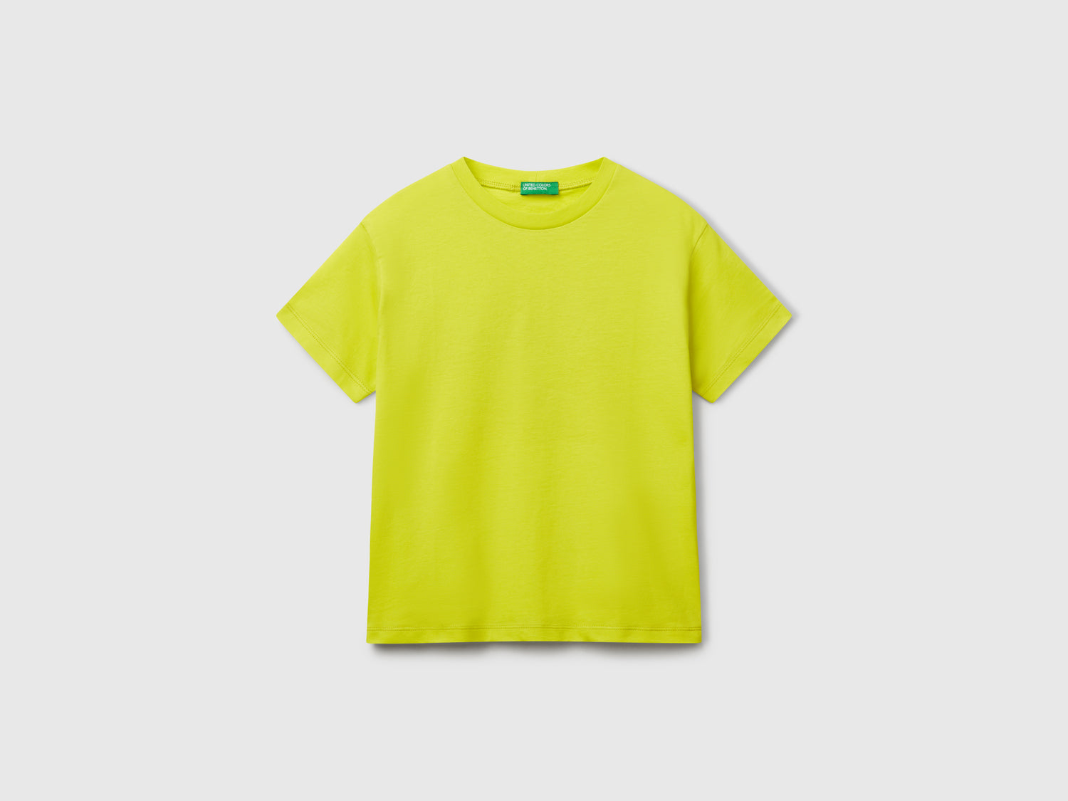 Maglietta in cotone con stampa da bambino giallo fluo | Benetton Outlet