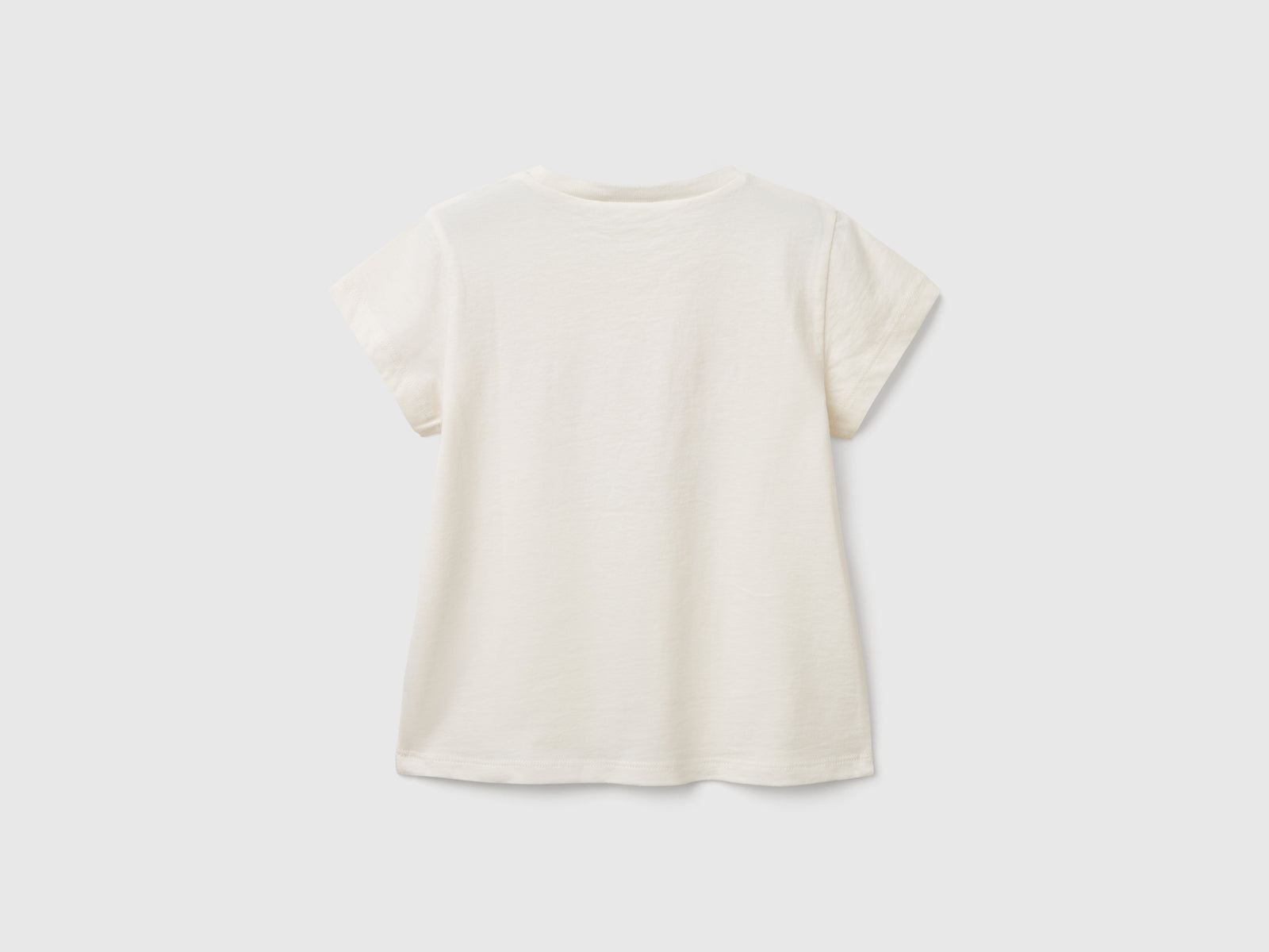 T-shirt con applicazione effetto petali da bimba bianco panna 2 | Benetton Outlet