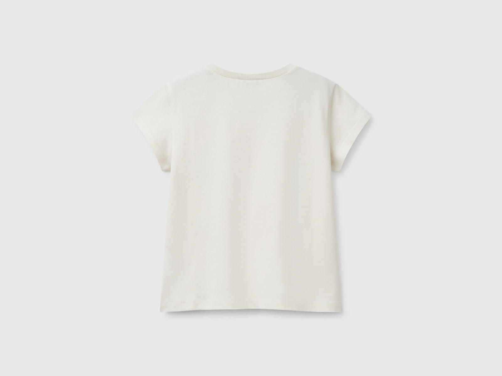 T-shirt in cotone con glitter da bimba beige 2 | Benetton Outlet