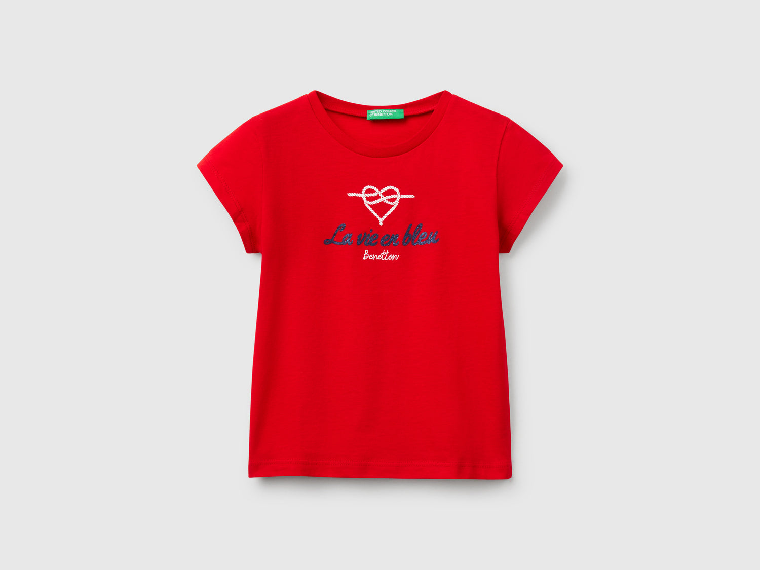 T-shirt in cotone con glitter da bimba rosso | Benetton Outlet