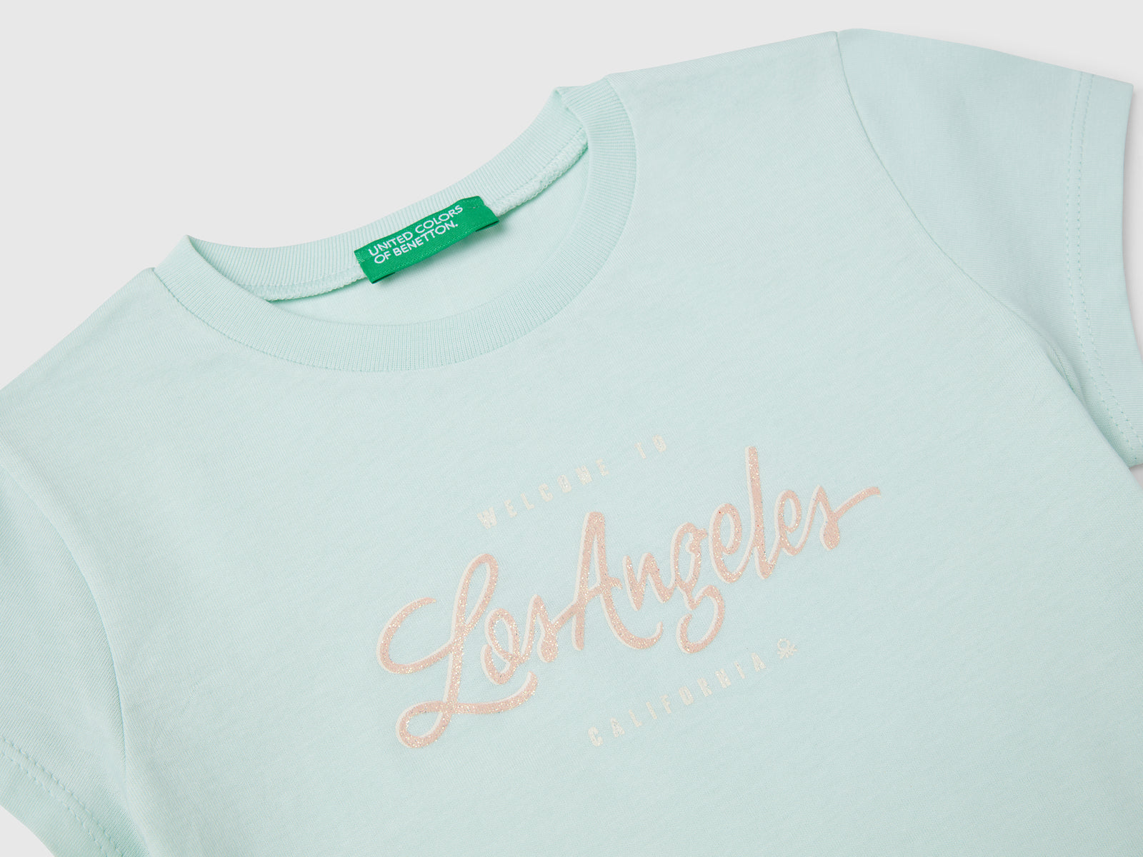 T-shirt in cotone con glitter da bimba verde acqua 3 | Benetton Outlet