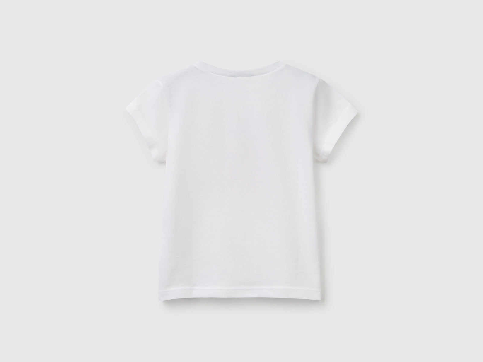 T-shirt in cotone con glitter da bimba bianco 2 | Benetton Outlet