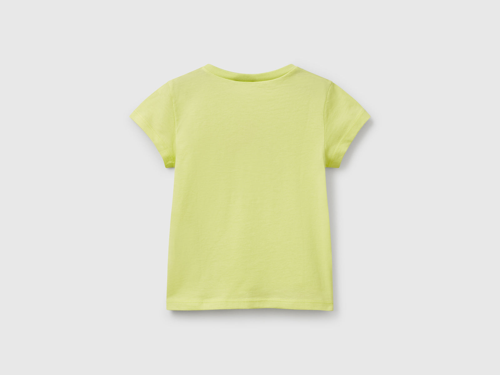 T-shirt in cotone con glitter da bimba giallo 2 | Benetton Outlet