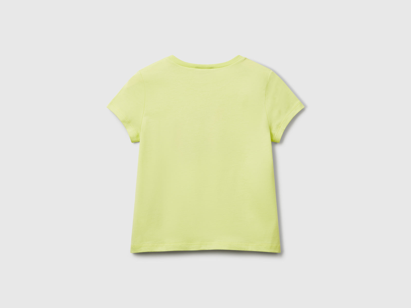 T-shirt regular fit con glitter da bimba lime 2 | Benetton Outlet