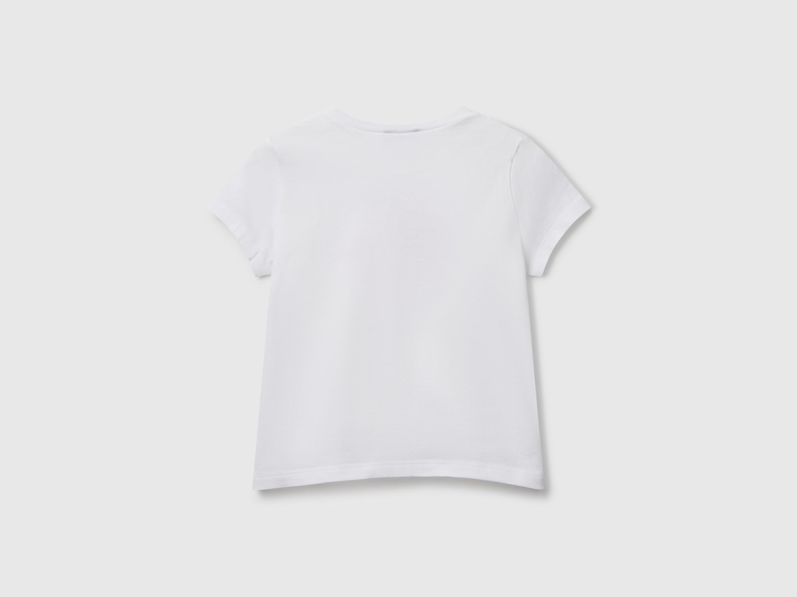 T-shirt regular fit con glitter da bimba bianco 2 | Benetton Outlet