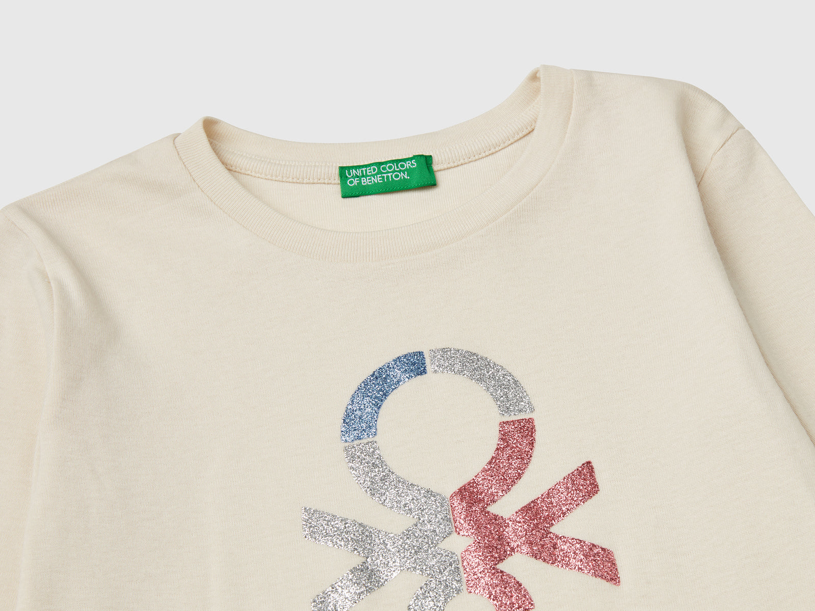 Maglietta a manica lunga con stampa glitter da bambina bianco panna 3 | Benetton Outlet