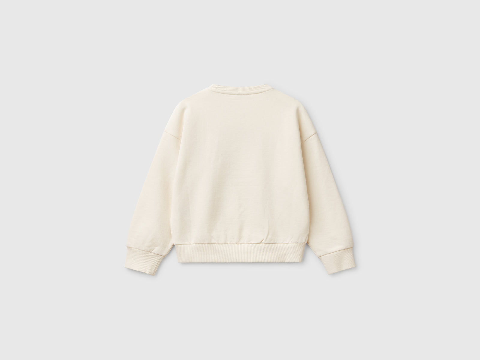 Felpa con paillettes da bambina bianco panna 2 | Benetton Outlet