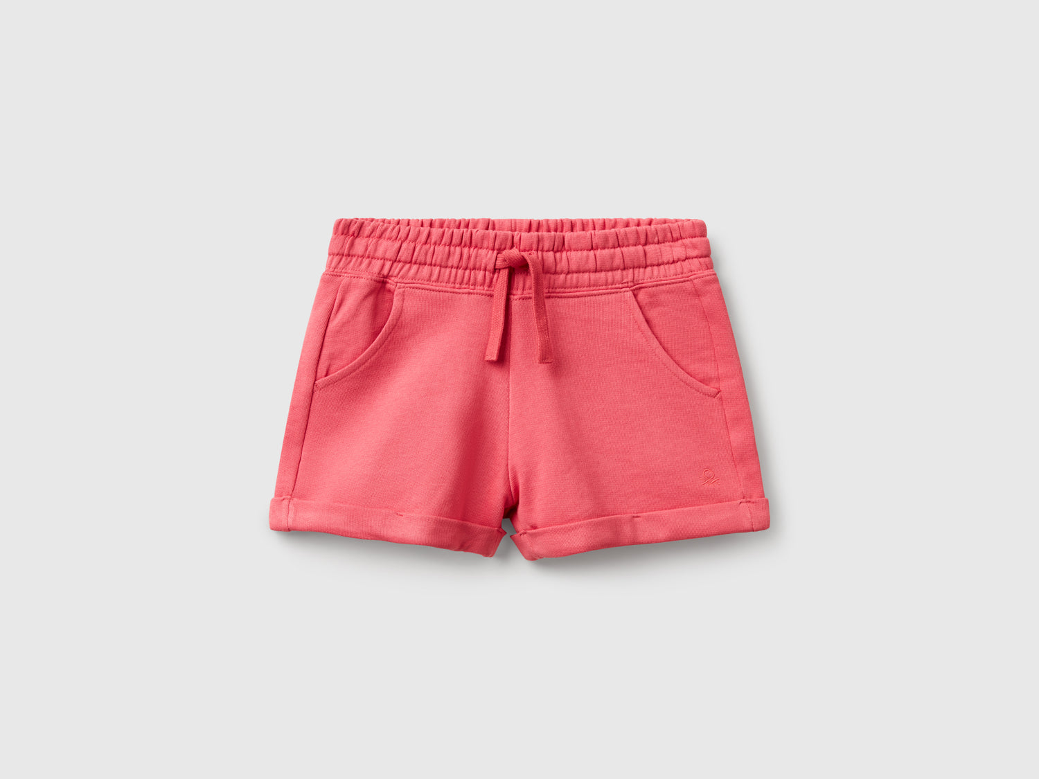 Shorts in felpa 100% cotone da bambina salmone | Benetton Outlet
