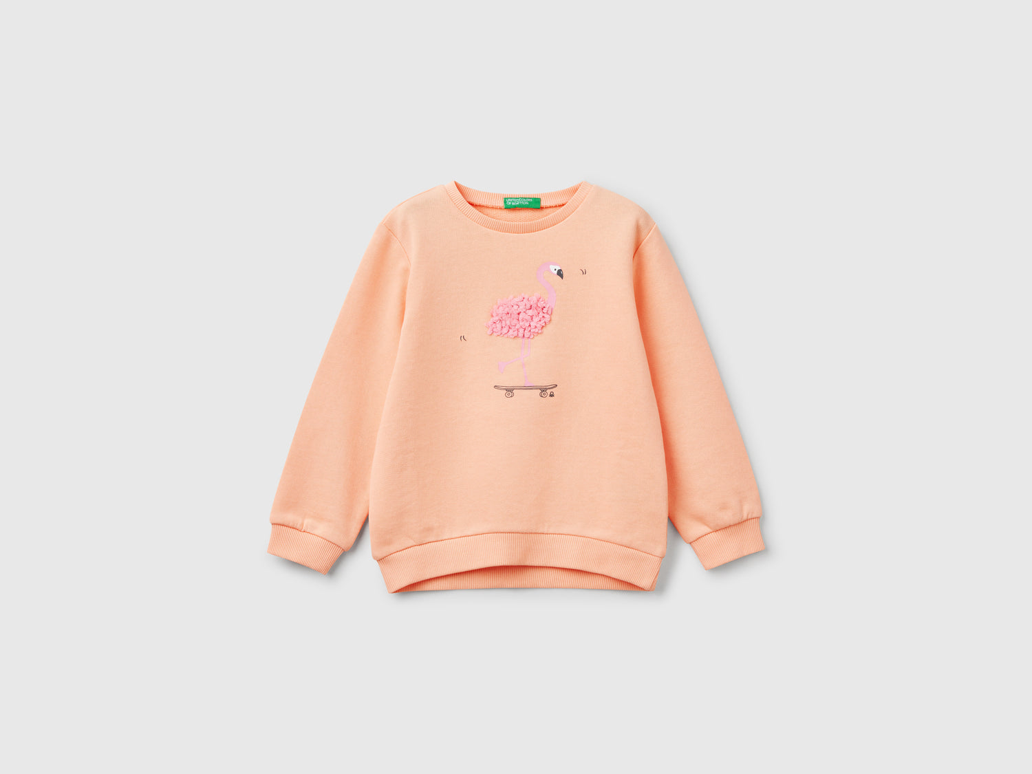 Felpa con applicazione effetto petali da bimba pesca | Benetton Outlet