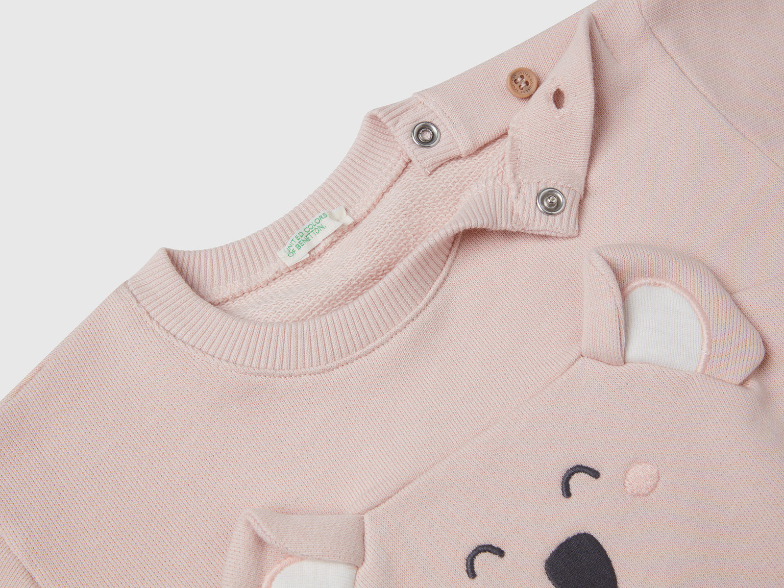 Felpa con ricamo e patch in cotone da neonato rosa tenue 3 | Benetton Outlet
