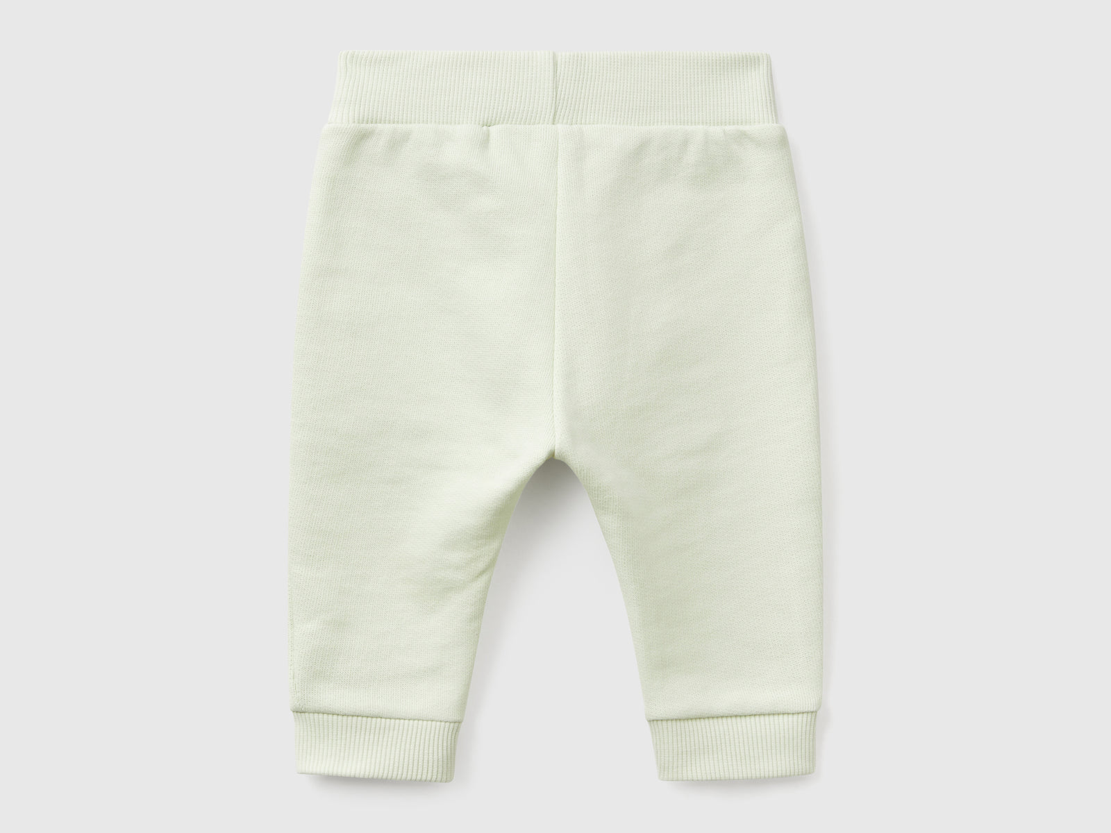 Pantaloni in felpa di cotone da neonato verde chiaro 2 | Benetton Outlet