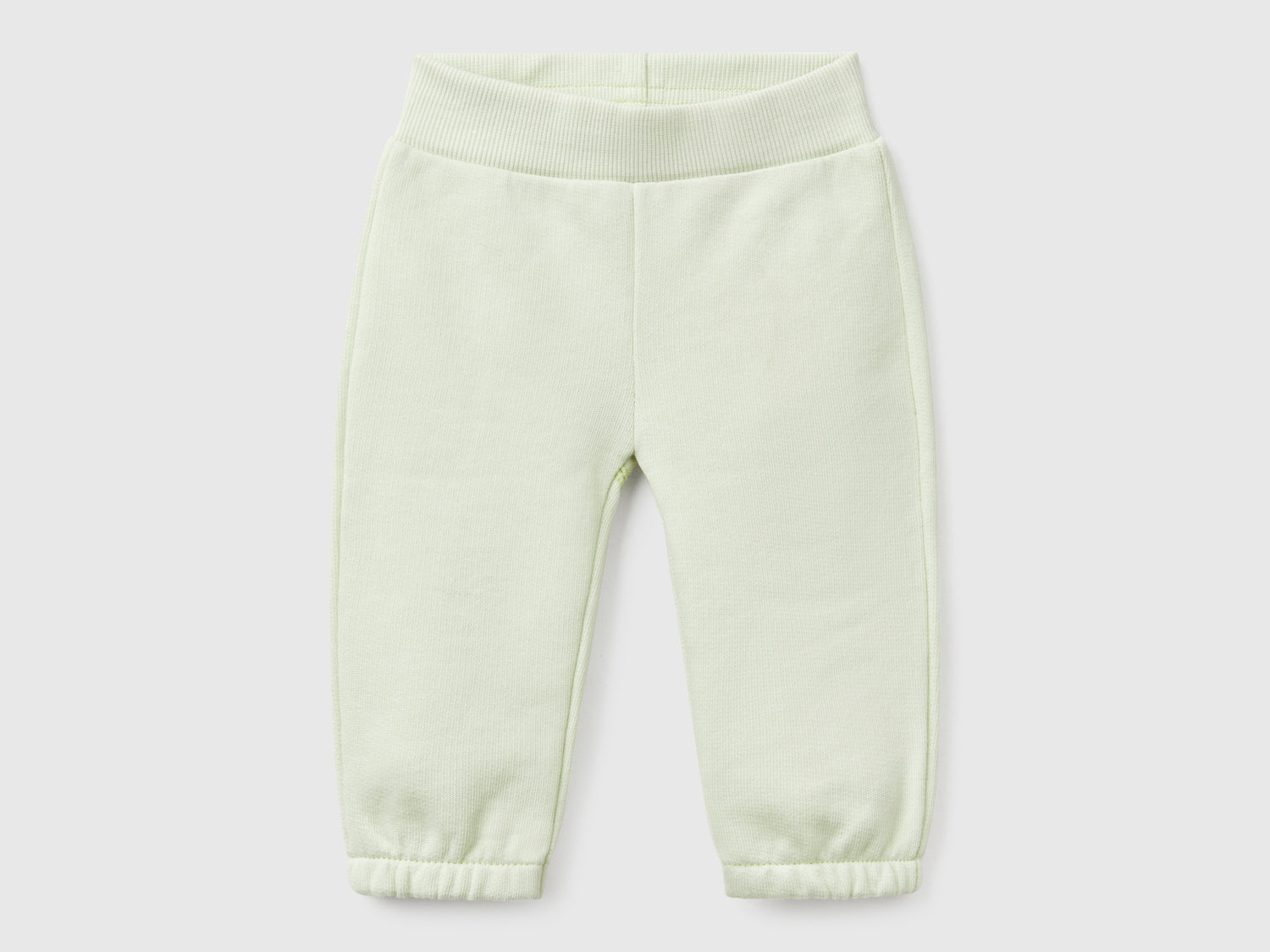 Pantaloni in felpa di cotone da neonato verde chiaro | Benetton Outlet