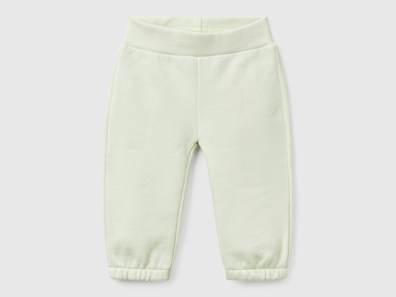 Pantaloni in felpa di cotone da neonato verde chiaro | Benetton Outlet