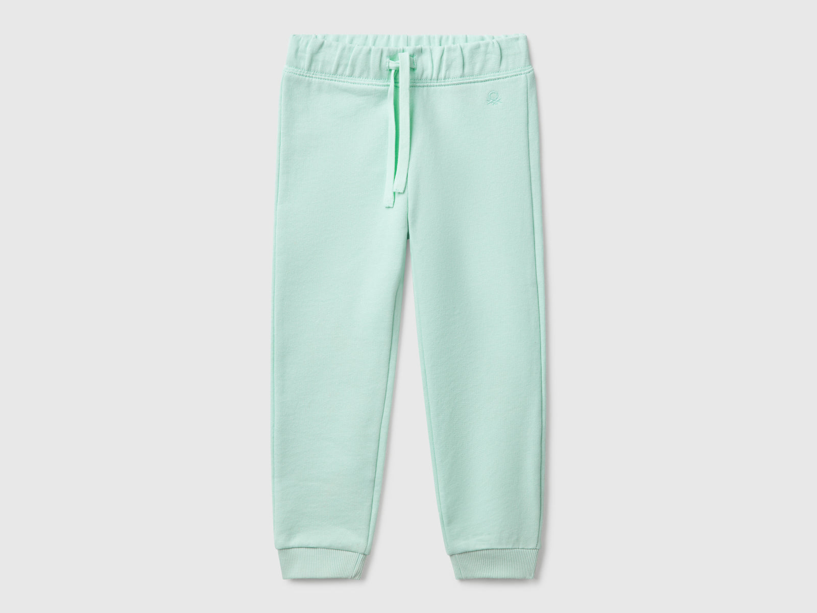 Pantaloni in felpa di cotone da bimba verde acqua | Benetton Outlet
