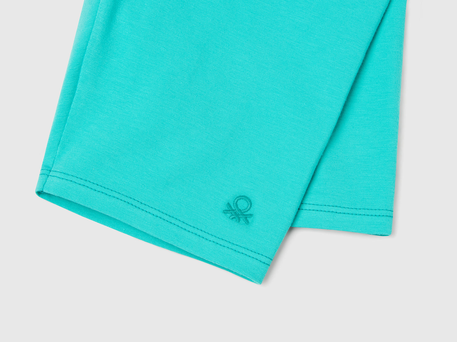 Leggings corti in cotone stretch da bambina celeste fluo 3 | Benetton Outlet