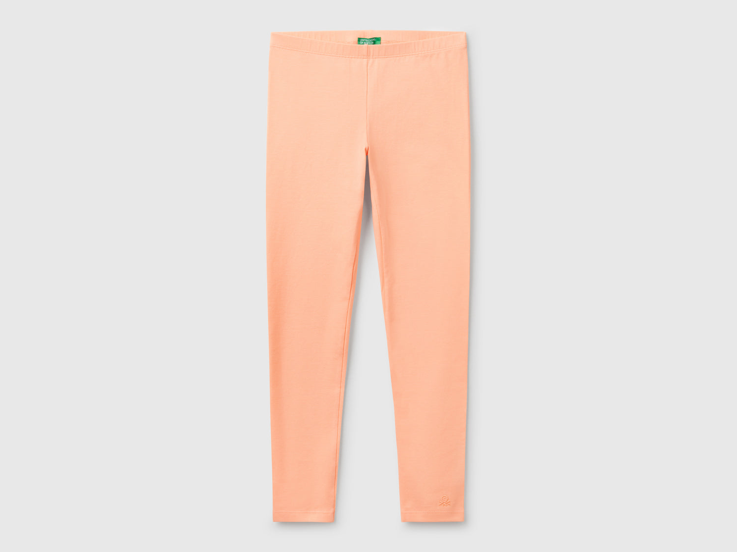 Leggings in cotone stretch con logo da bambina pesca | Benetton Outlet