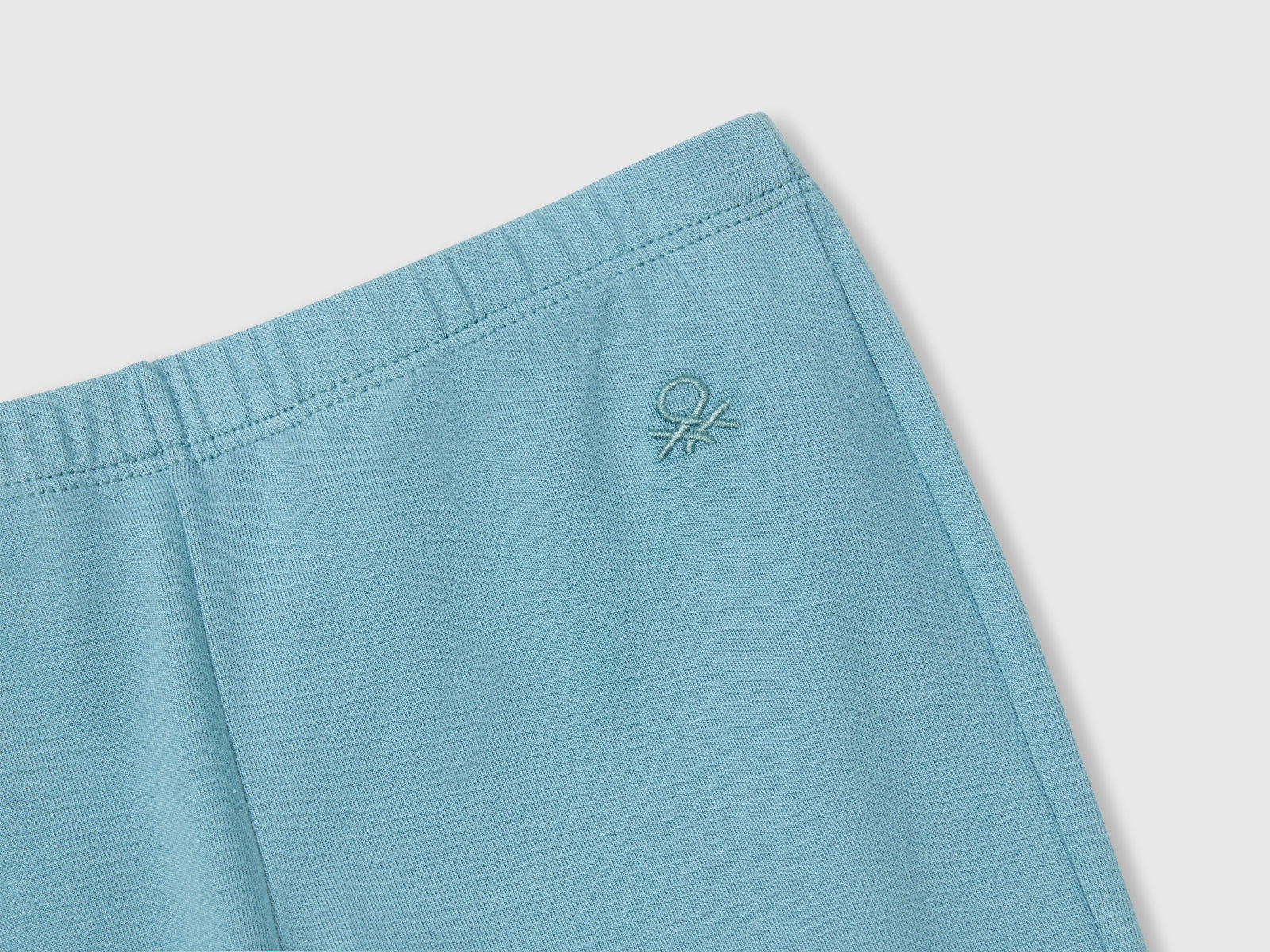 Leggings a zampa in cotone stretch da bambina verde acqua 3 | Benetton Outlet