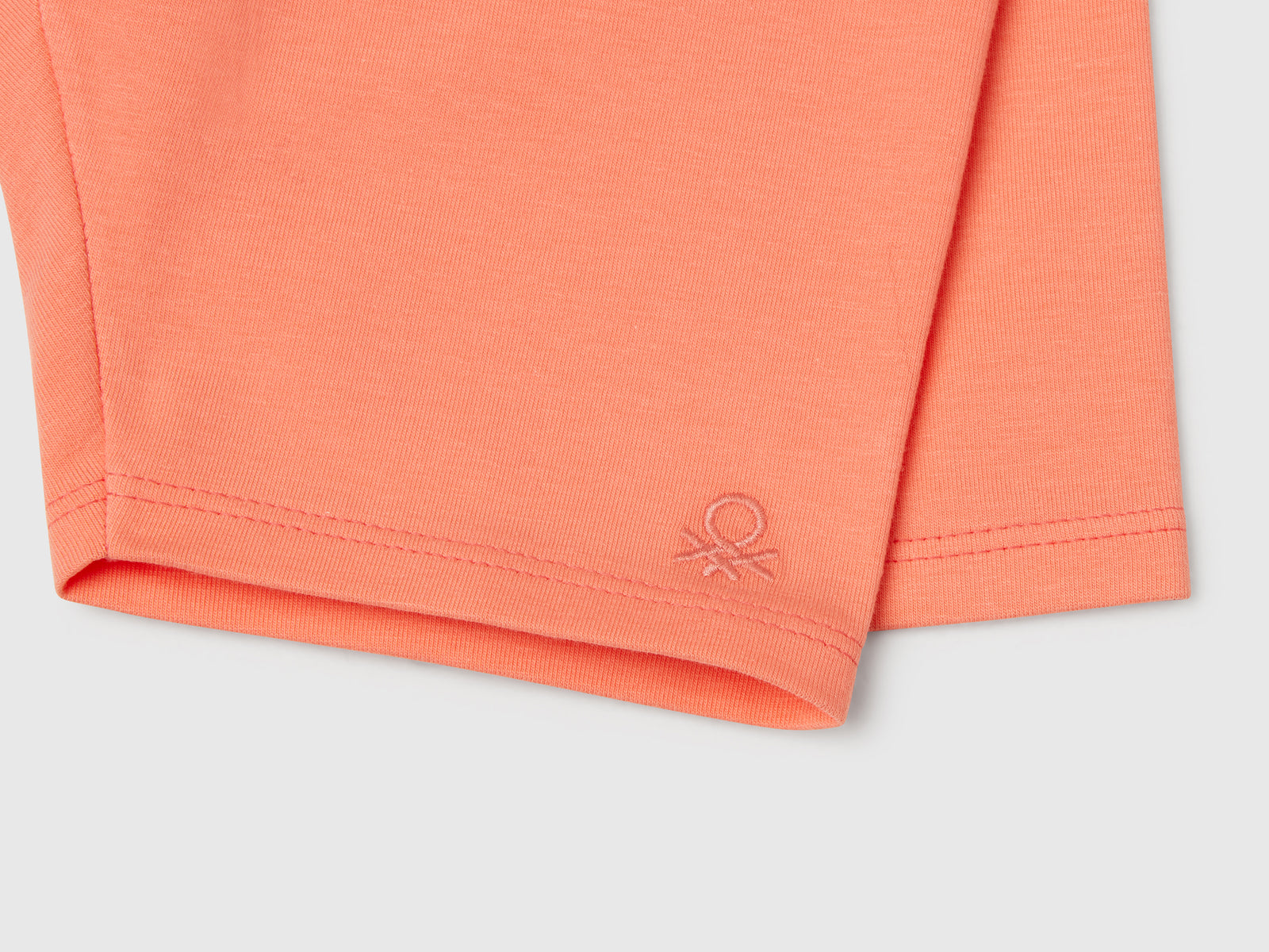 Leggings corti skinny fit da bimba pesca 3 | Benetton Outlet