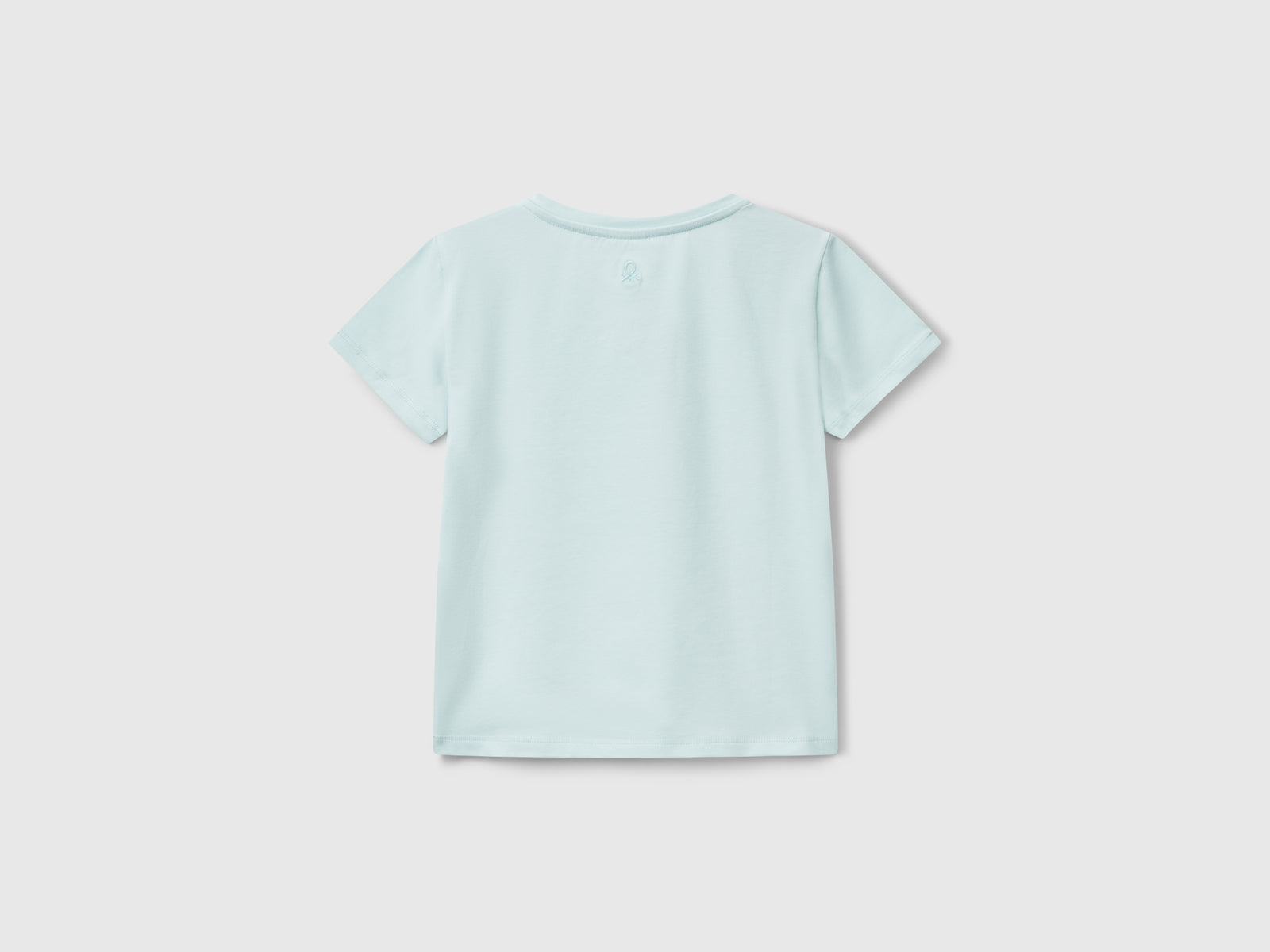 Maglietta con motivo cut out da bambina verde acqua 2 | Benetton Outlet