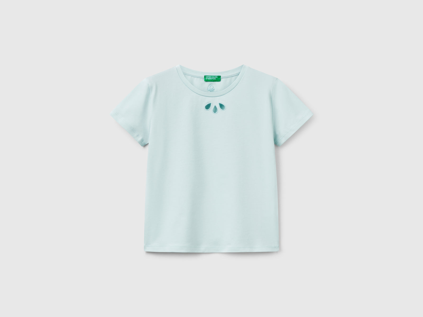 Maglietta con motivo cut out da bambina verde acqua | Benetton Outlet