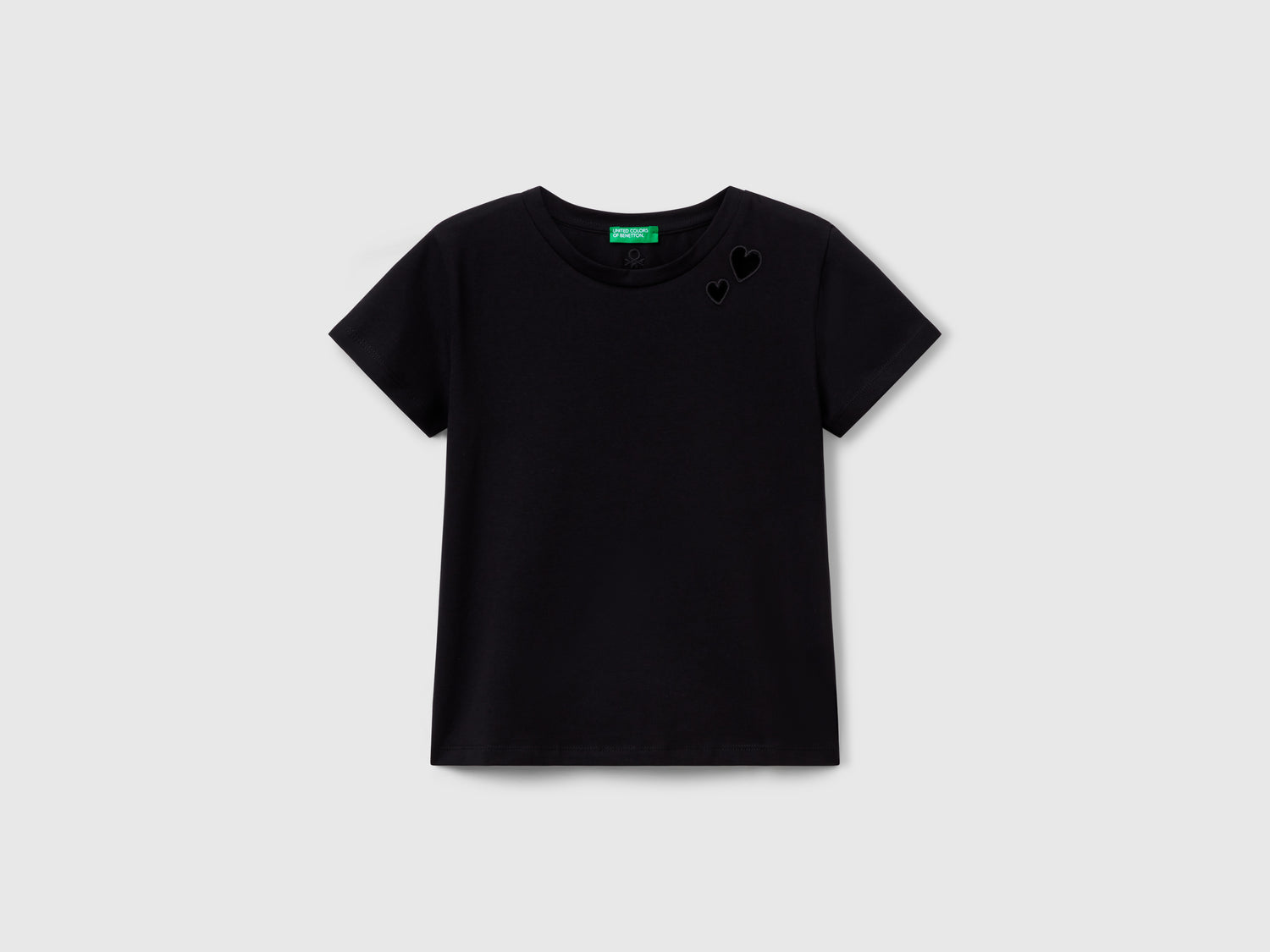 Maglietta con motivo cut out da bambina nero | Benetton Outlet