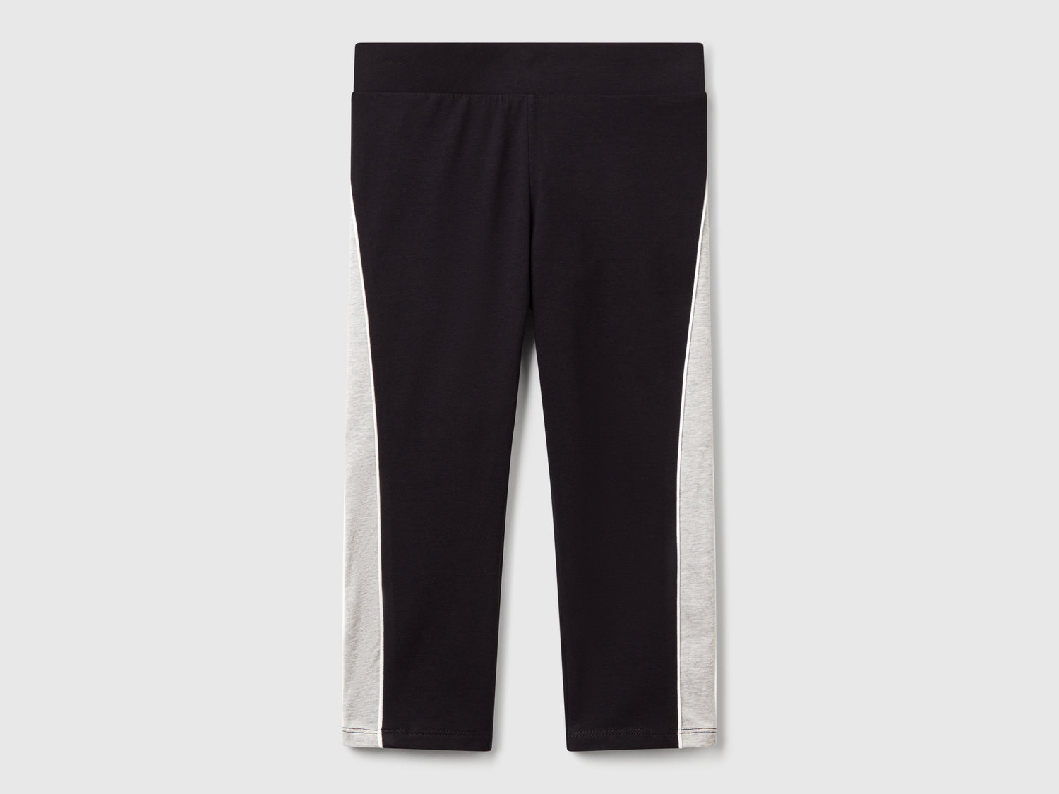 Leggings sportivi con piping da bambina nero | Benetton Outlet