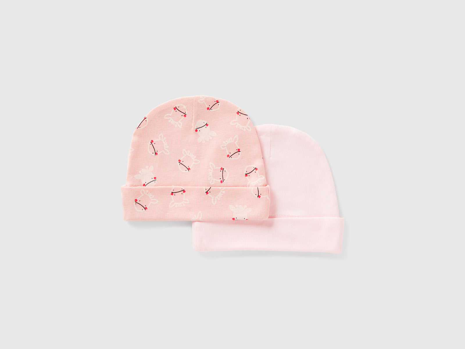Due cappellini in cotone da neonato rosa tenue 2 | Benetton Outlet