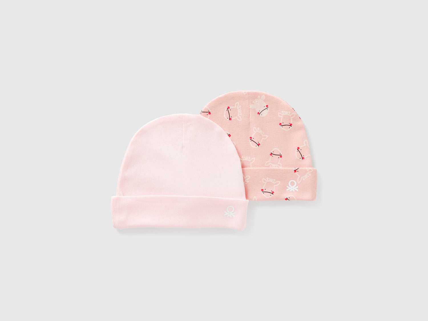Due cappellini in cotone da neonato rosa tenue | Benetton Outlet