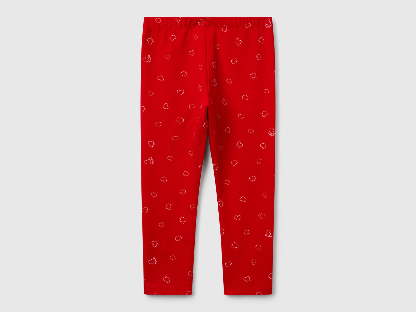 Leggings rossi con stampa cuori da bimba rosso 2 | Benetton Outlet