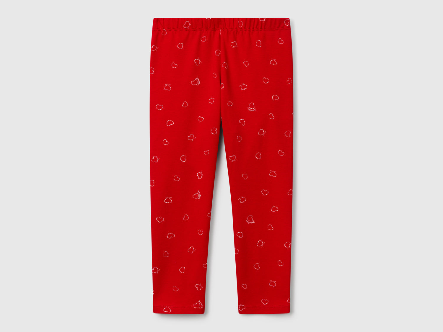 Leggings rossi con stampa cuori da bimba rosso | Benetton Outlet