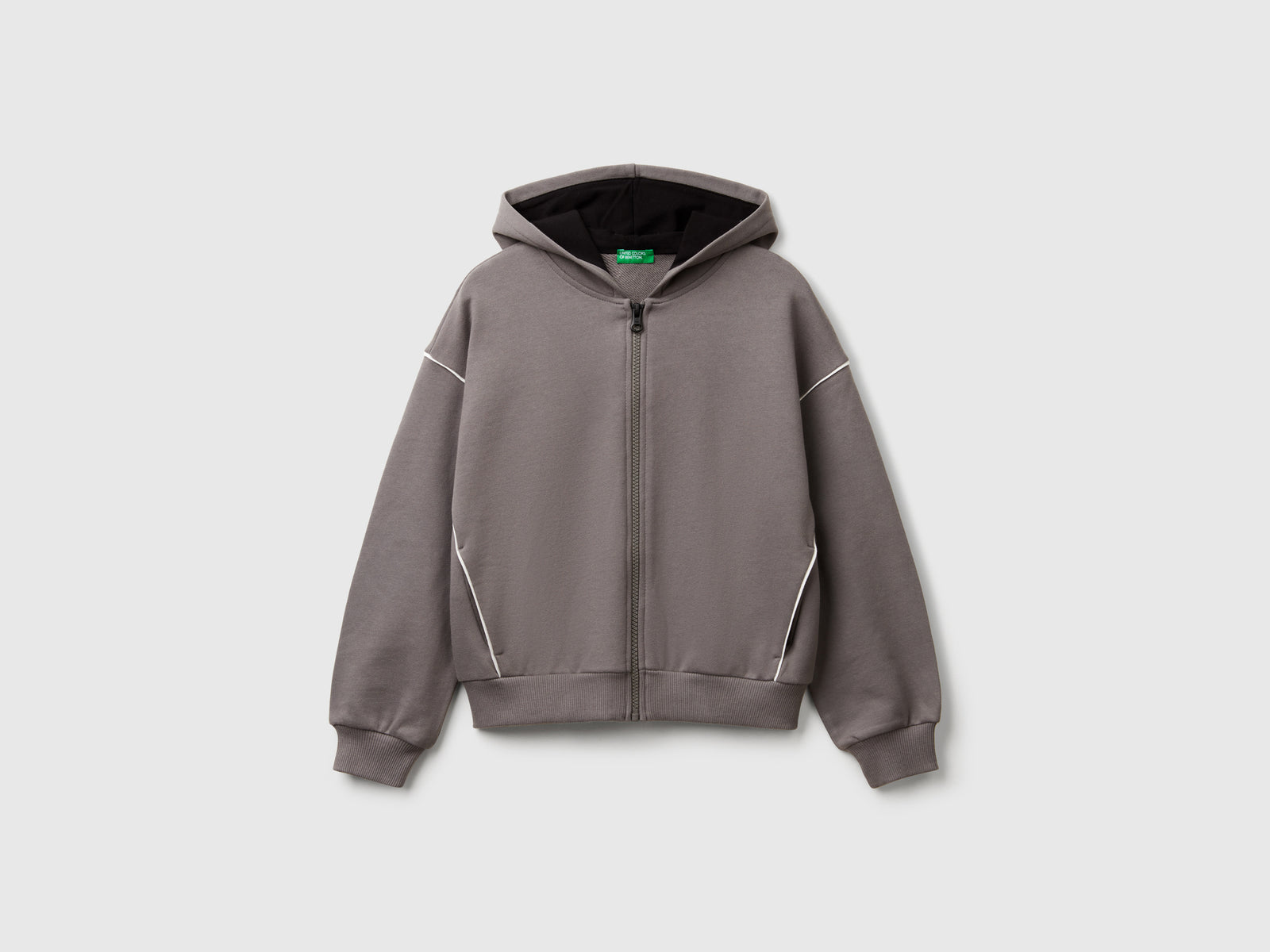 Felpa over fit con cappuccio da bambina grigio scuro | Benetton Outlet