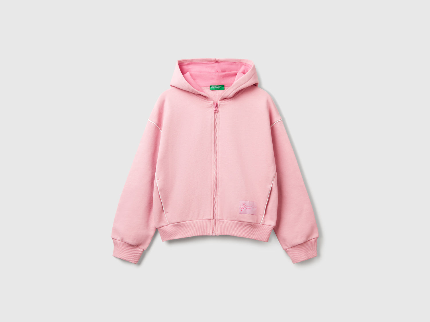 Felpa over fit con cappuccio da bambina rosa | Benetton Outlet